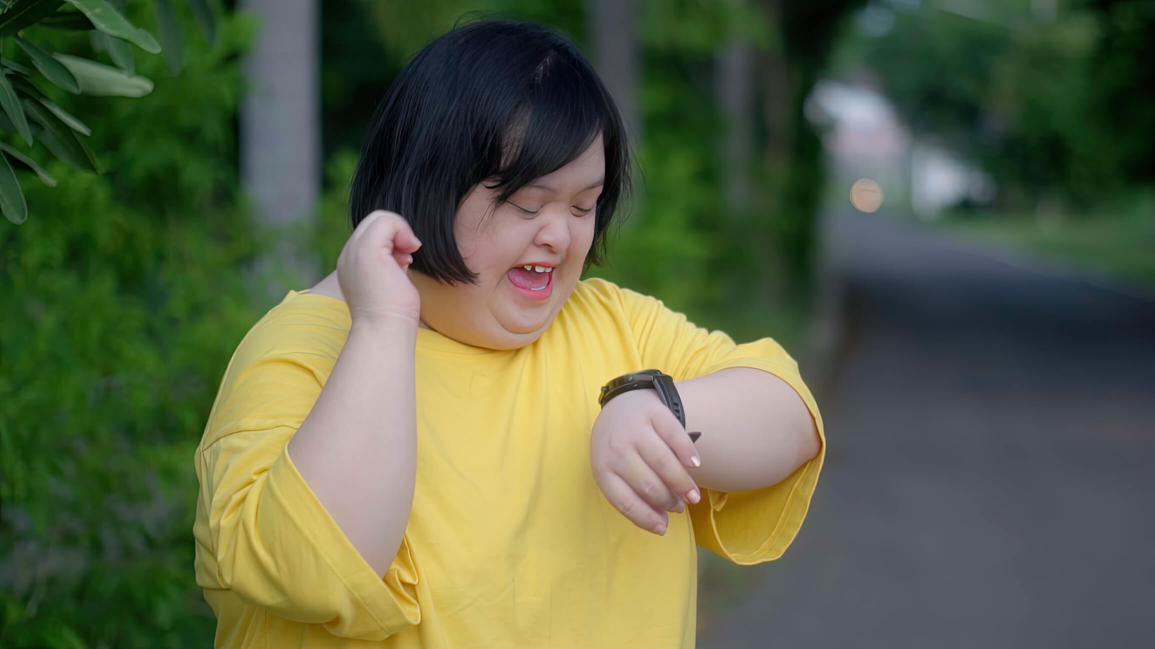 Person With intellectual disabilities looking at wearable task prompting