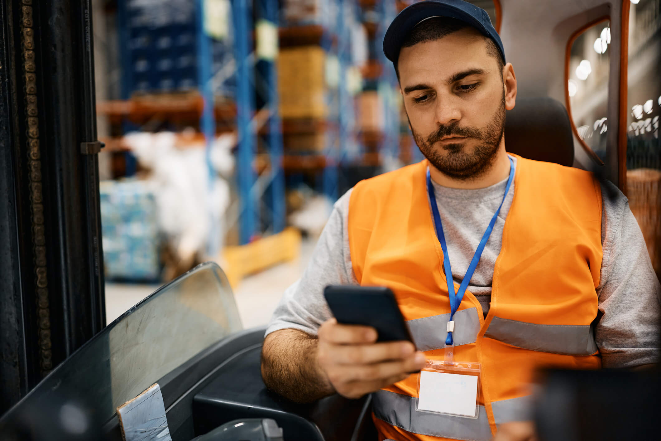 Man with autism using tasks on phone to do his job